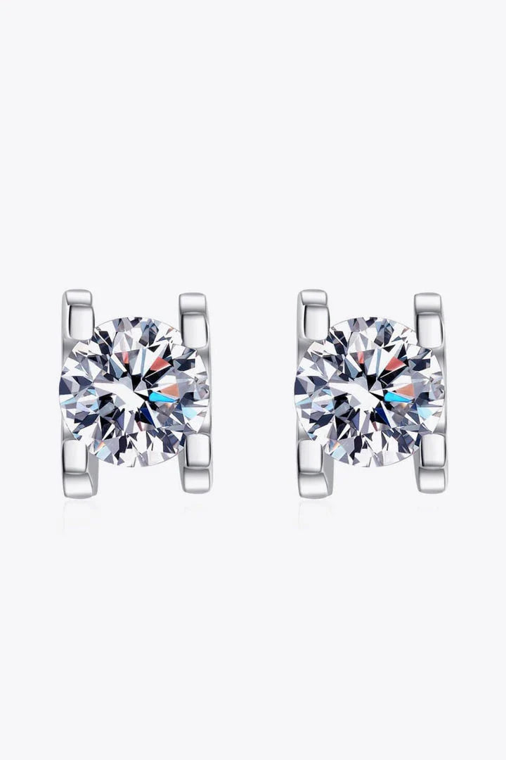 Pair of elegant 1 carat moissanite stud earrings in a minimalist silver setting, perfect for everyday wear or special occasions.
