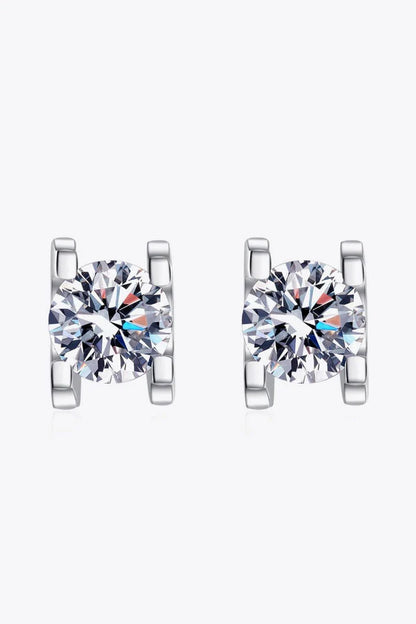 Pair of elegant 1 carat moissanite stud earrings in a minimalist silver setting, perfect for everyday wear or special occasions.