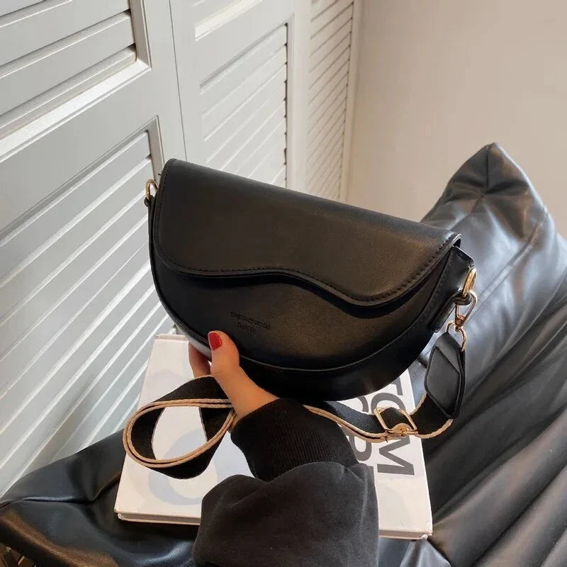 A stylish pillow-shaped shoulder bag made of high-quality PU leather, featuring a crossbody and messenger design for versatile use.