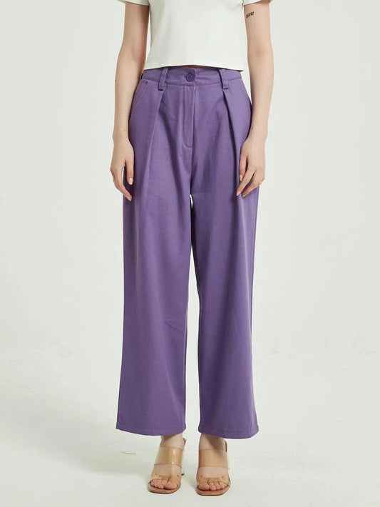 Elegant purple high-waisted wide-leg trousers with a vintage-inspired design, perfect for the modern British woman