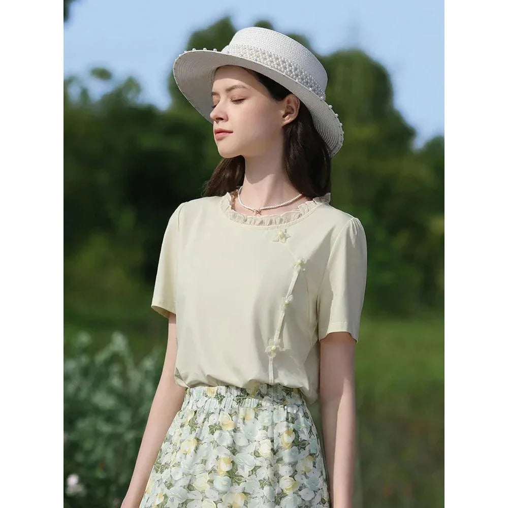 Elegant floral short sleeve t-shirt with wooden ear side detail, perfect for chic British summer style