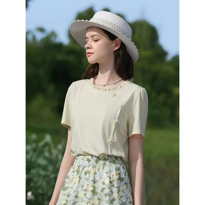 Elegant floral short sleeve t-shirt with wooden ear side detail, perfect for chic British summer style