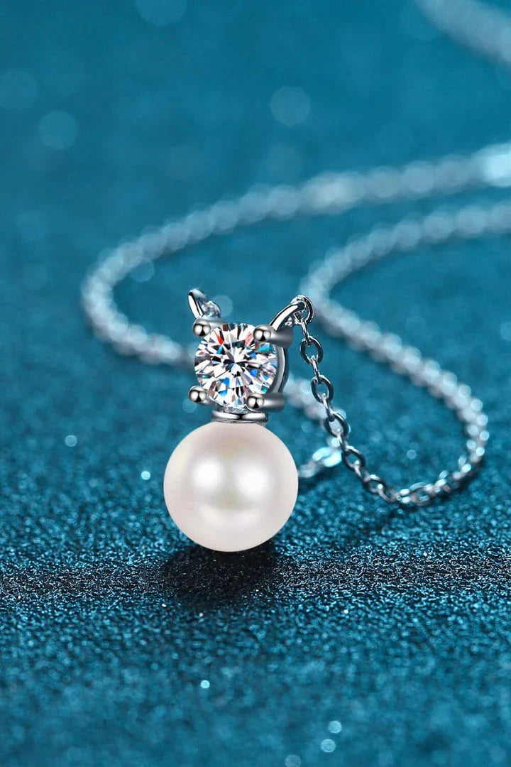 925 sterling silver necklace featuring freshwater pearls and a moissanite centre stone, a stunning piece of British-inspired jewellery