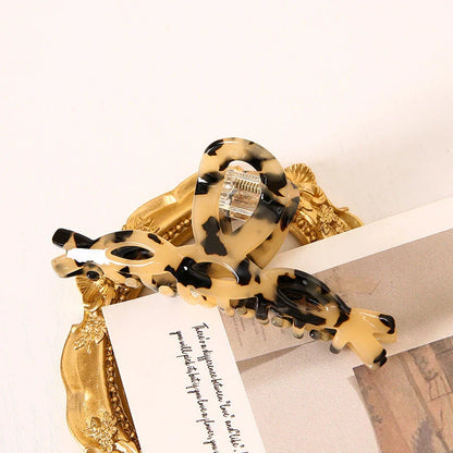 Elegant leopard print large weave hair clip made of high-quality acrylic and alloy materials for a stylish and secure hairstyle