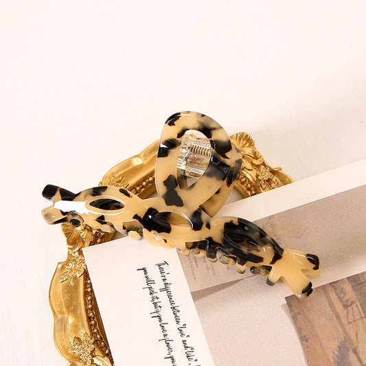 Elegant leopard print large weave hair clip made of high-quality acrylic and alloy materials for a stylish and secure hairstyle