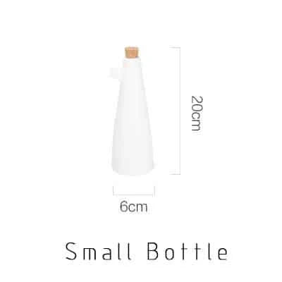Elegant white porcelain storage bottles with Mediterranean-inspired design for kitchen organisation and decor