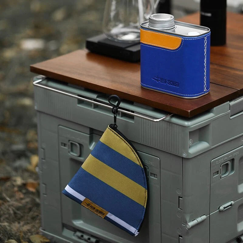 Airtight metal coffee and tea canister with portable filter paper storage, perfect for camping and home use
