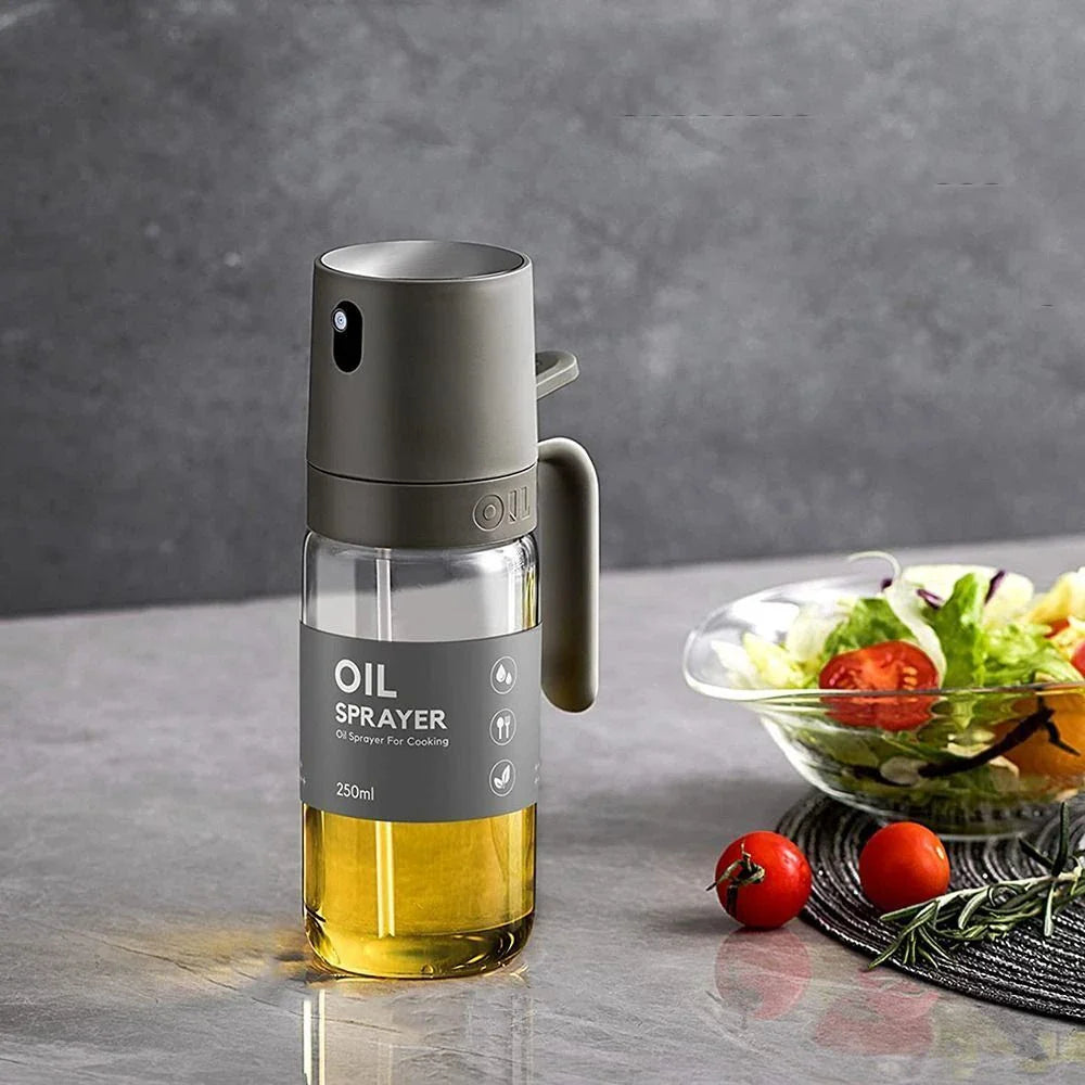 Elegant borosilicate glass oil spray bottle with ergonomic design for hassle-free, healthy cooking