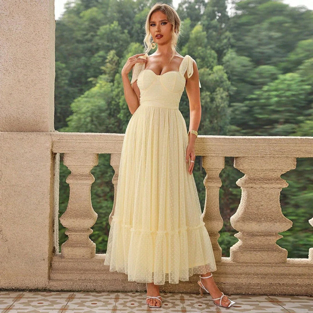 Enchanting fairy-style dress with flowing silhouette, delicate lace accents, and mid-length skirt in a classic black colour