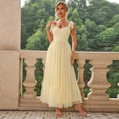 Enchanting fairy-style dress with flowing silhouette, delicate lace accents, and mid-length skirt in a classic black colour