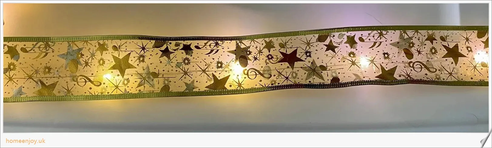 Festive Christmas ribbon fairy lights with 100 warm LED lights, available in gold and silver colours
