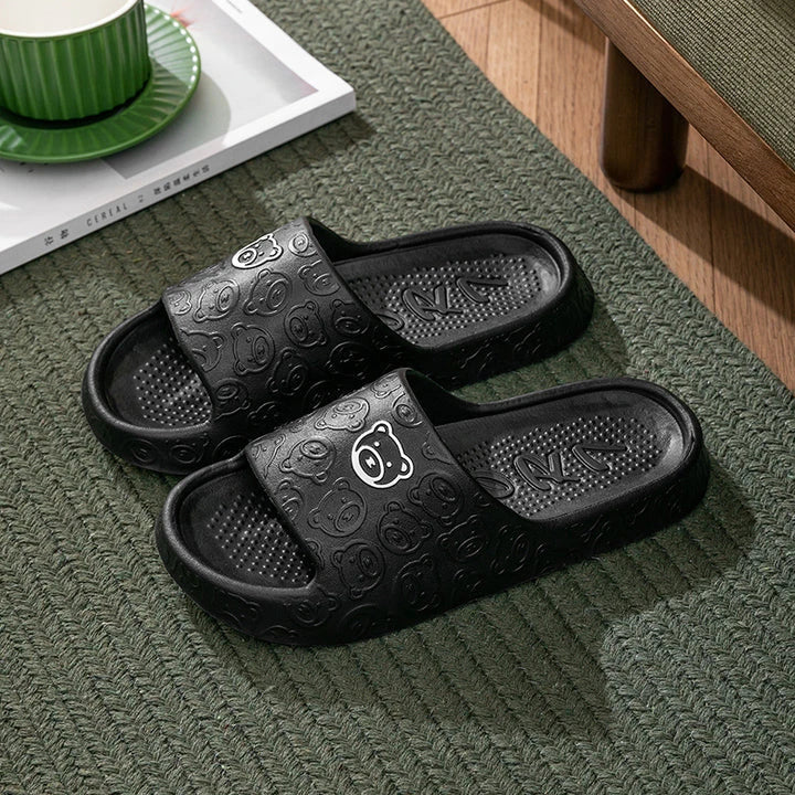 Cosy bear paw slippers in purple colour with soft, plush lining for relaxing indoor wear