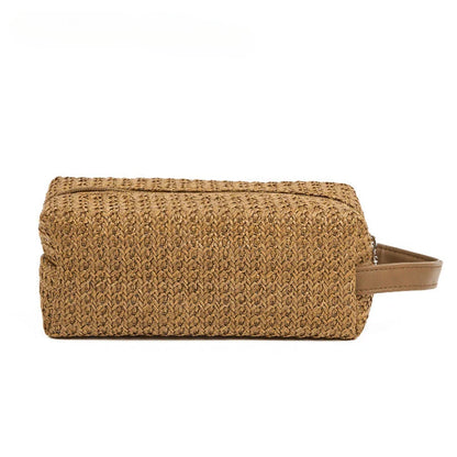 Elegant straw cosmetic bag with unique knitting pattern, ideal for organizing makeup and toiletries