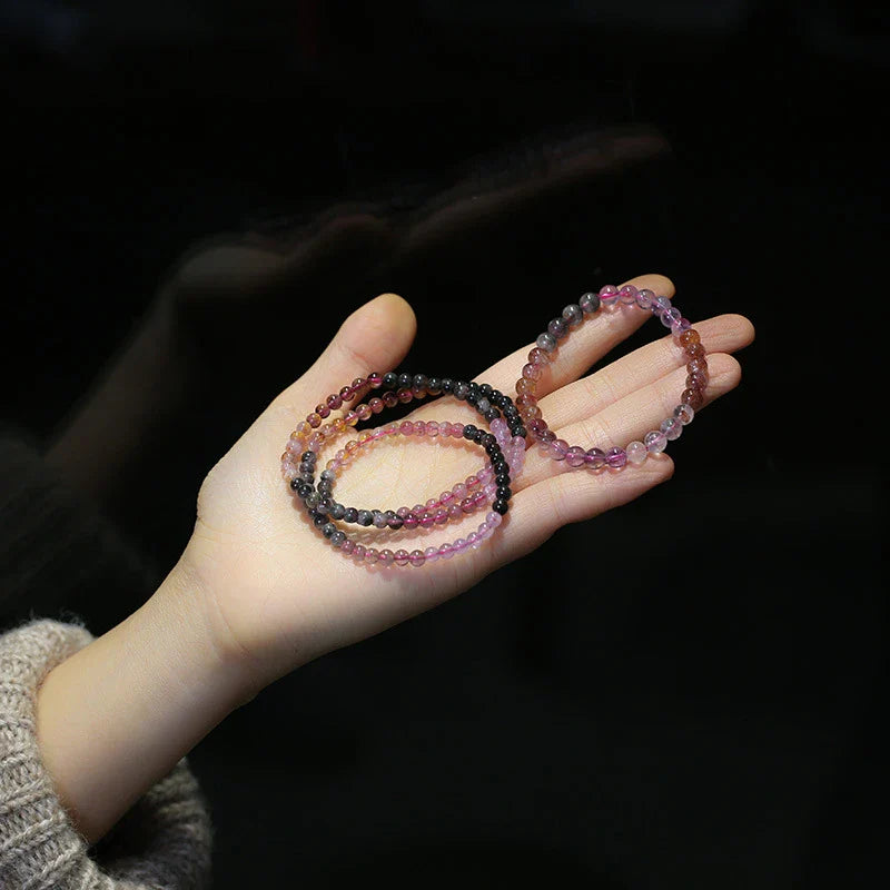 A close-up view of a ladies' fashion bracelet featuring a single loop design with sparkling crystal beads