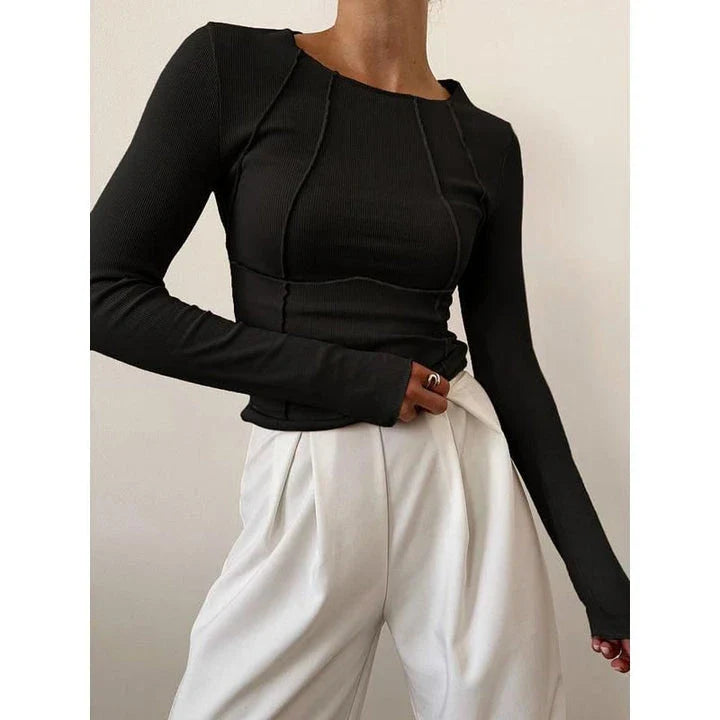 A model wearing a comfortable and stylish long sleeve t-shirt in a solid white colour.