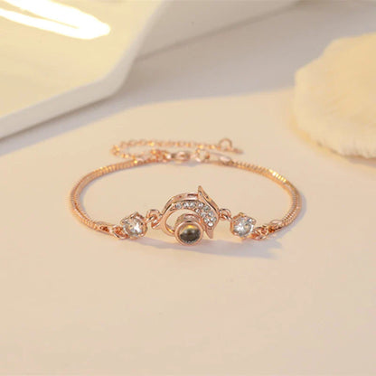 Couple wearing vibrant, projection couple bracelets in rose gold and platinum finishes