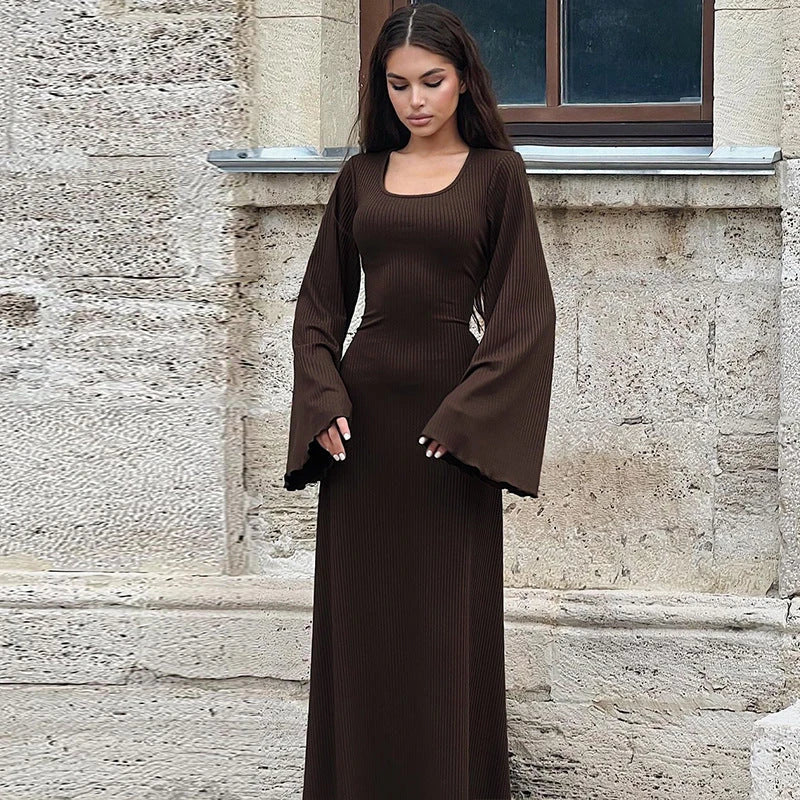 Elegant U-neck dress with lace-up back and flowing bell sleeves in a variety of sophisticated colours