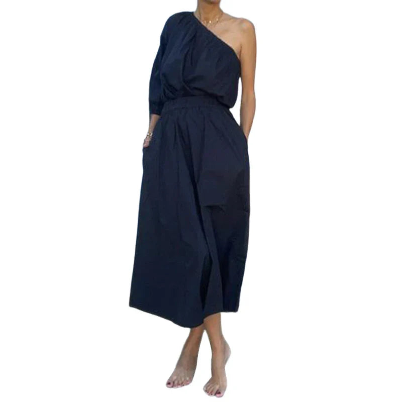 Elegant two-piece set with oblique shoulder blouse and midi skirt in black colour