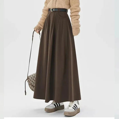 Elegant high-waisted pleated maxi skirt for stylish British women, featuring a classic A-line silhouette and solid colour design