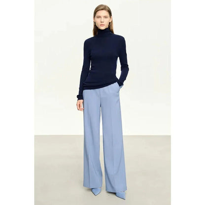 A cosy and stylish turtleneck sweater with a unique patchwork design, made from a premium wool blend for exceptional comfort and elegance.