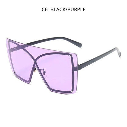 Stylish oversized flat top sunglasses with a rimless design, providing UV protection and a comfortable fit for the modern British woman
