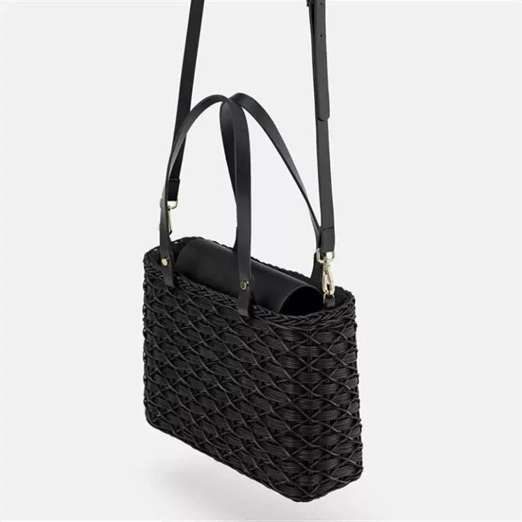 Handwoven rattan handbag in black with a sleek, elegant design for effortless style and practicality