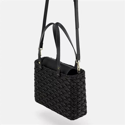 Handwoven rattan handbag in black with a sleek, elegant design for effortless style and practicality