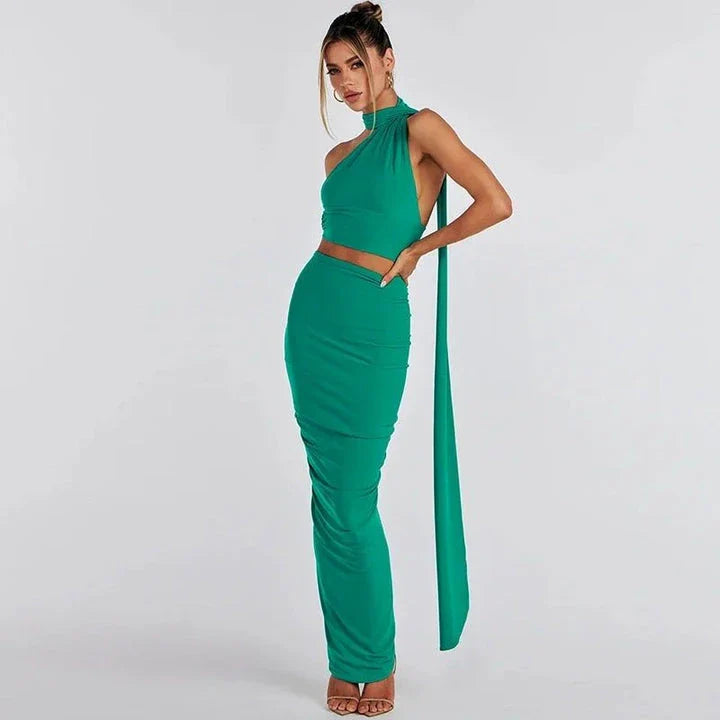 Elegant backless cocktail dress set with halter crop top and maxi skirt, perfect for summer events and occasions