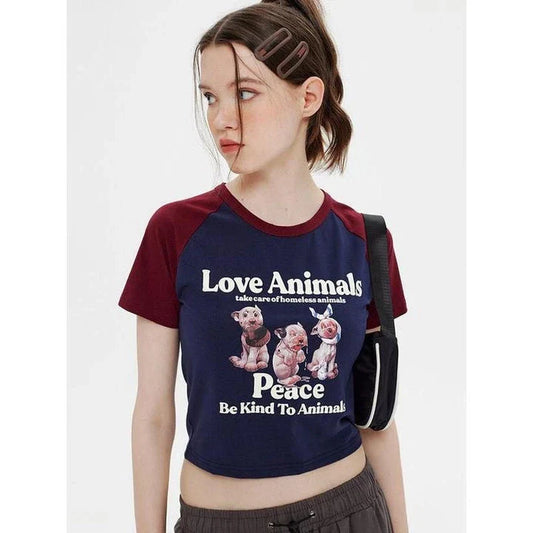 Enchanting animal print crop top with raglan sleeves and distressed details, perfect for casual summer outfits.