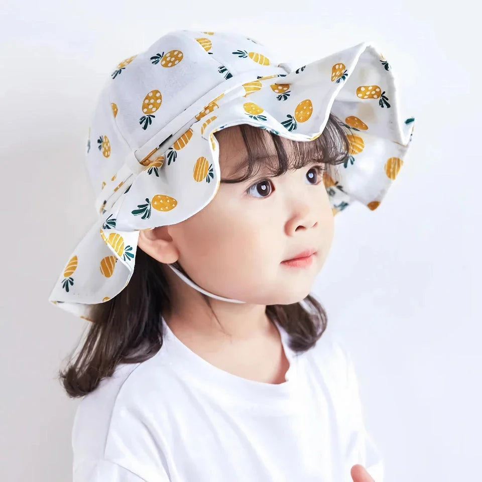 Adjustable cotton sun protection bucket hats for children with whimsical cartoon designs