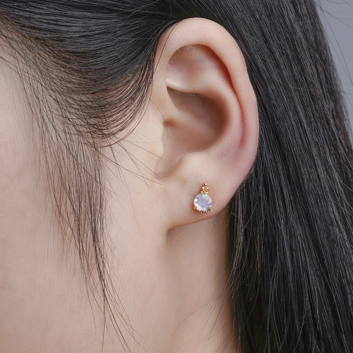 Elegant elongated stone earrings with a geometric design and a white crystal, a sophisticated accessory for the discerning British woman.