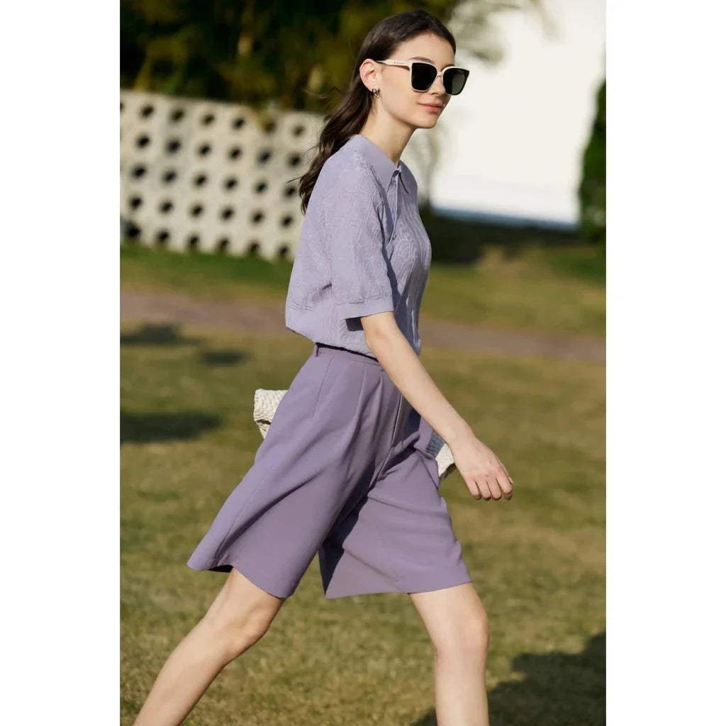 Elegant wide-leg shirred shorts in deep blue, designed for the modern British woman