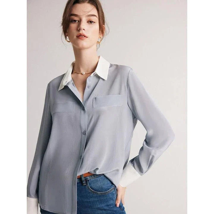 A chic and elegant silk crepe de chine blouse in a timeless solid pattern, perfect for professional and casual wear.