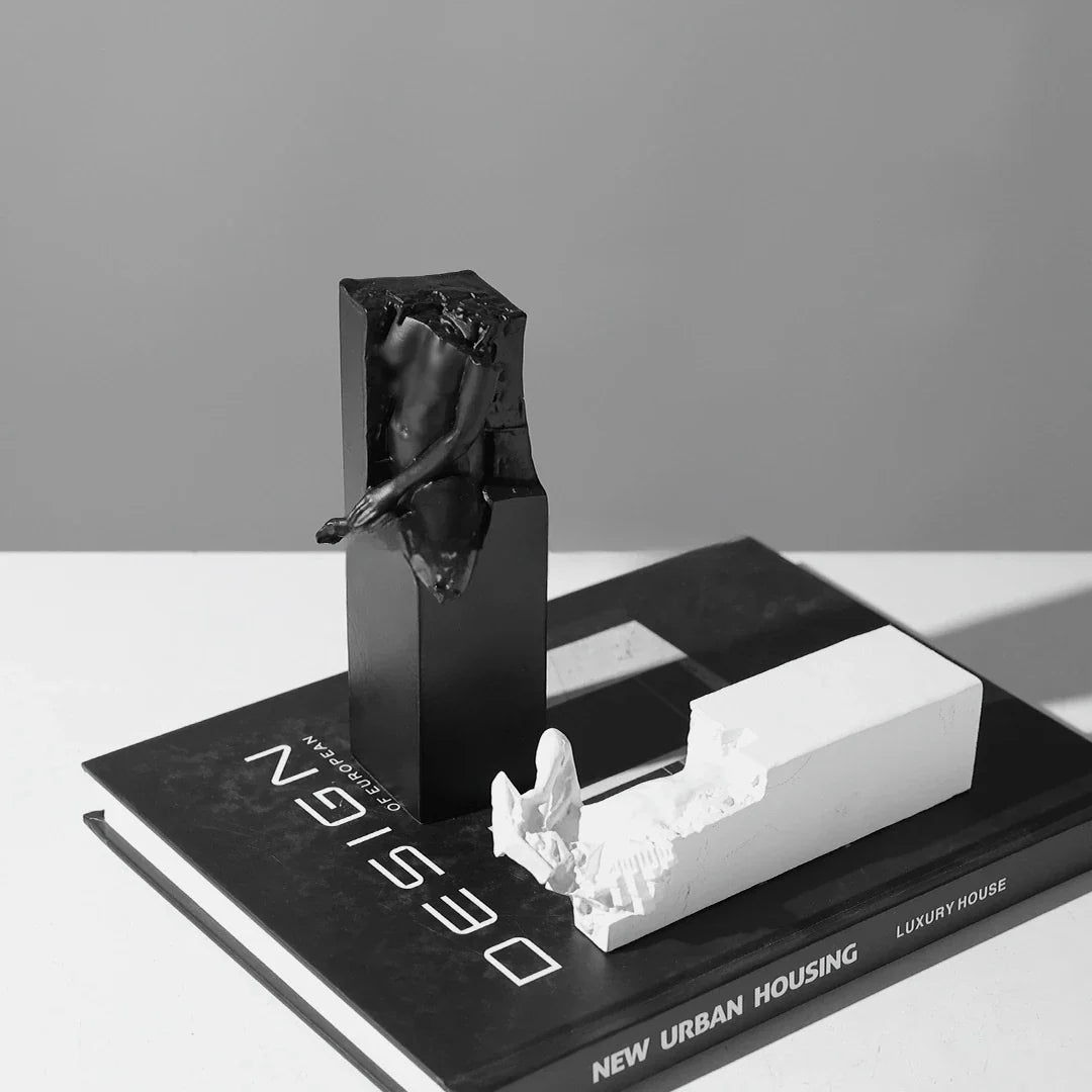 Elegant black and white abstract sculpture for desktop or study decor