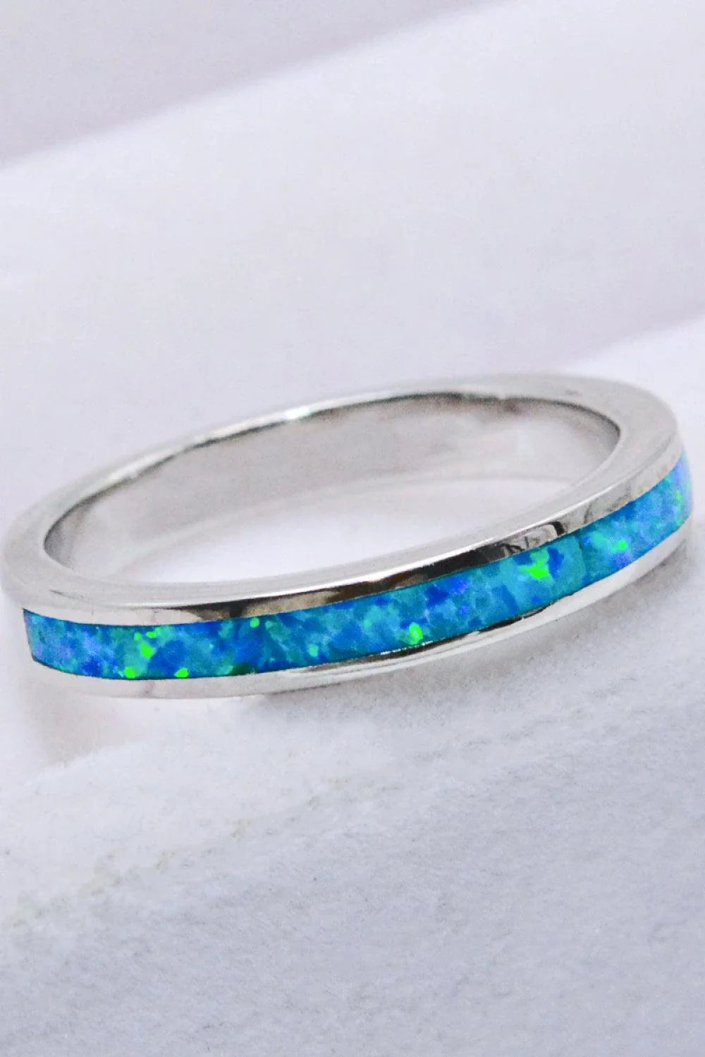 Elegant sterling silver ring with a mesmerizing sky blue opal gemstone, a modern and sophisticated accessory.