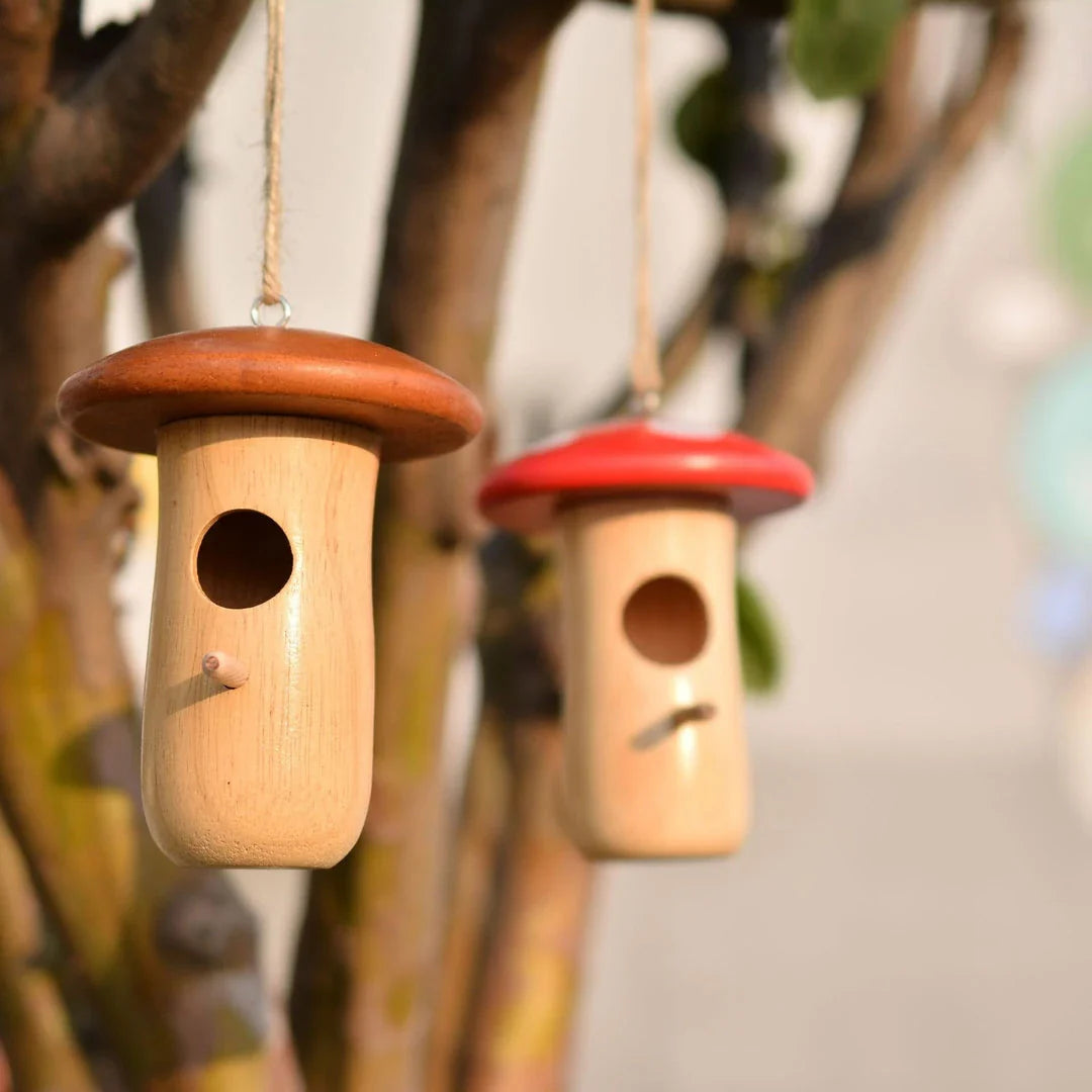A charming wooden hummingbird nest designed for outdoor gardens, providing a safe and cozy home for these delightful birds.