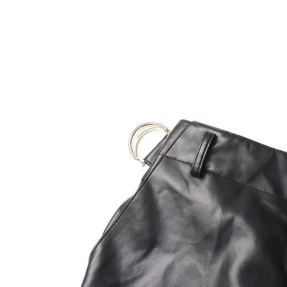 A pair of high-waist leather cargo pants with a stylish patchwork design, offering a blend of functionality and fashion for modern women.