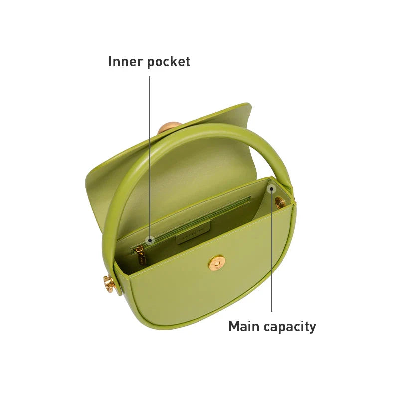 Exquisite red leather round handbag with ball-inlaid hardware, a chic and versatile accessory for UK fashion enthusiasts