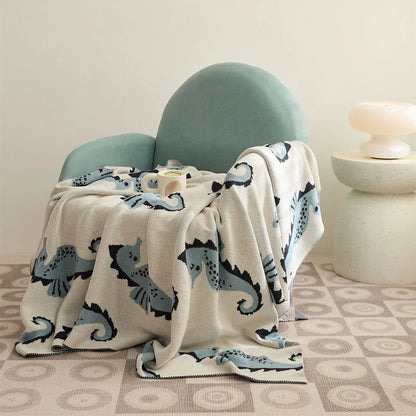 Cosy Sea Horse Cotton Throw Blanket in pink and lake blue colours, featuring a playful sea horse pattern and jacquard weave design.