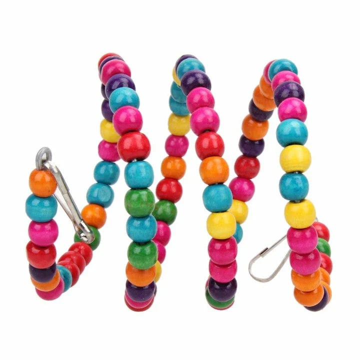 A premium British-made whimsical bird swing in multicoloured wood and iron, designed to provide a safe and entertaining play space for pet birds.