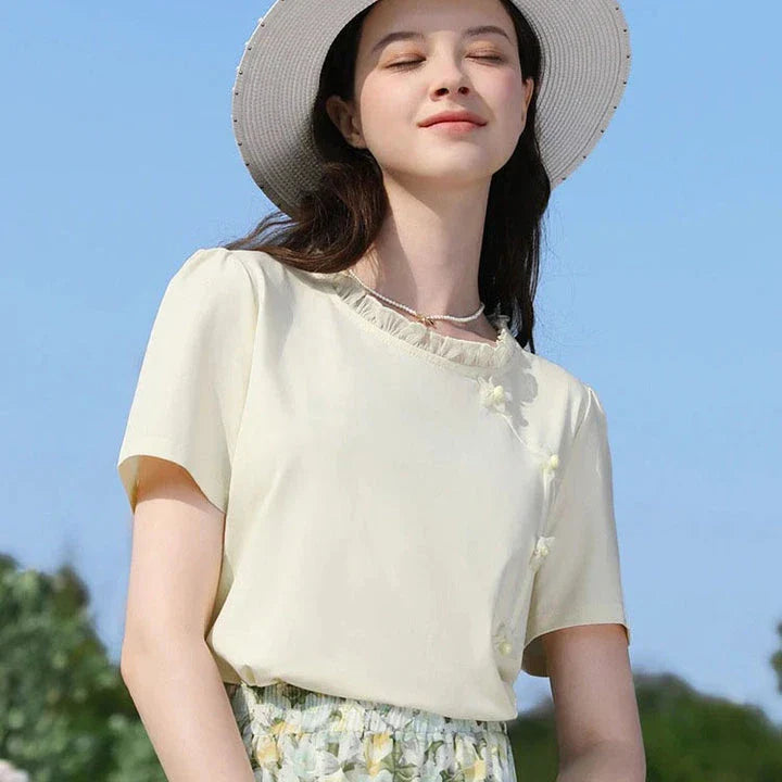 Elegant floral short sleeve t-shirt with wooden ear side detail, perfect for chic British summer style