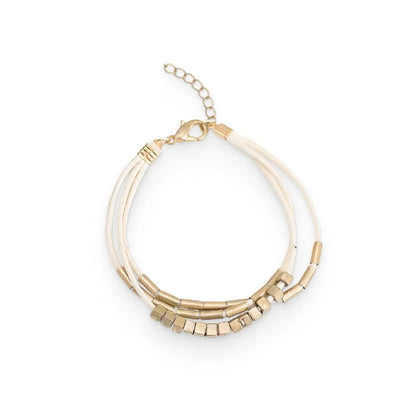 Elegant layered bracelet with beige leather and gold-coloured beads, a versatile accessory for modern British style