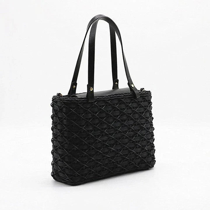 Handwoven rattan handbag in black with a sleek, elegant design for effortless style and practicality