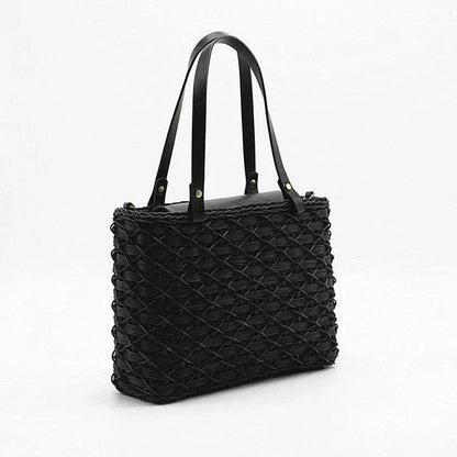 Handwoven rattan handbag in black with a sleek, elegant design for effortless style and practicality