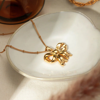 18K gold-plated stainless steel bowknot pendant necklace with sparkling zircon heart centre