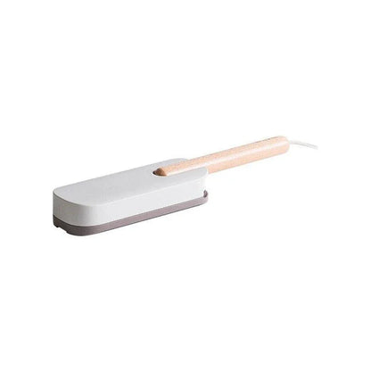 Premium pet hair removal brush with grey handle and bristles, designed for use in UK homes