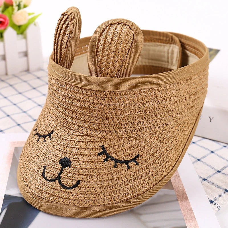 Rabbit-themed straw sun hat for kids with adjustable strap and foldable design for portability