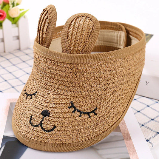 Rabbit-themed straw sun hat for kids with adjustable strap and foldable design for portability