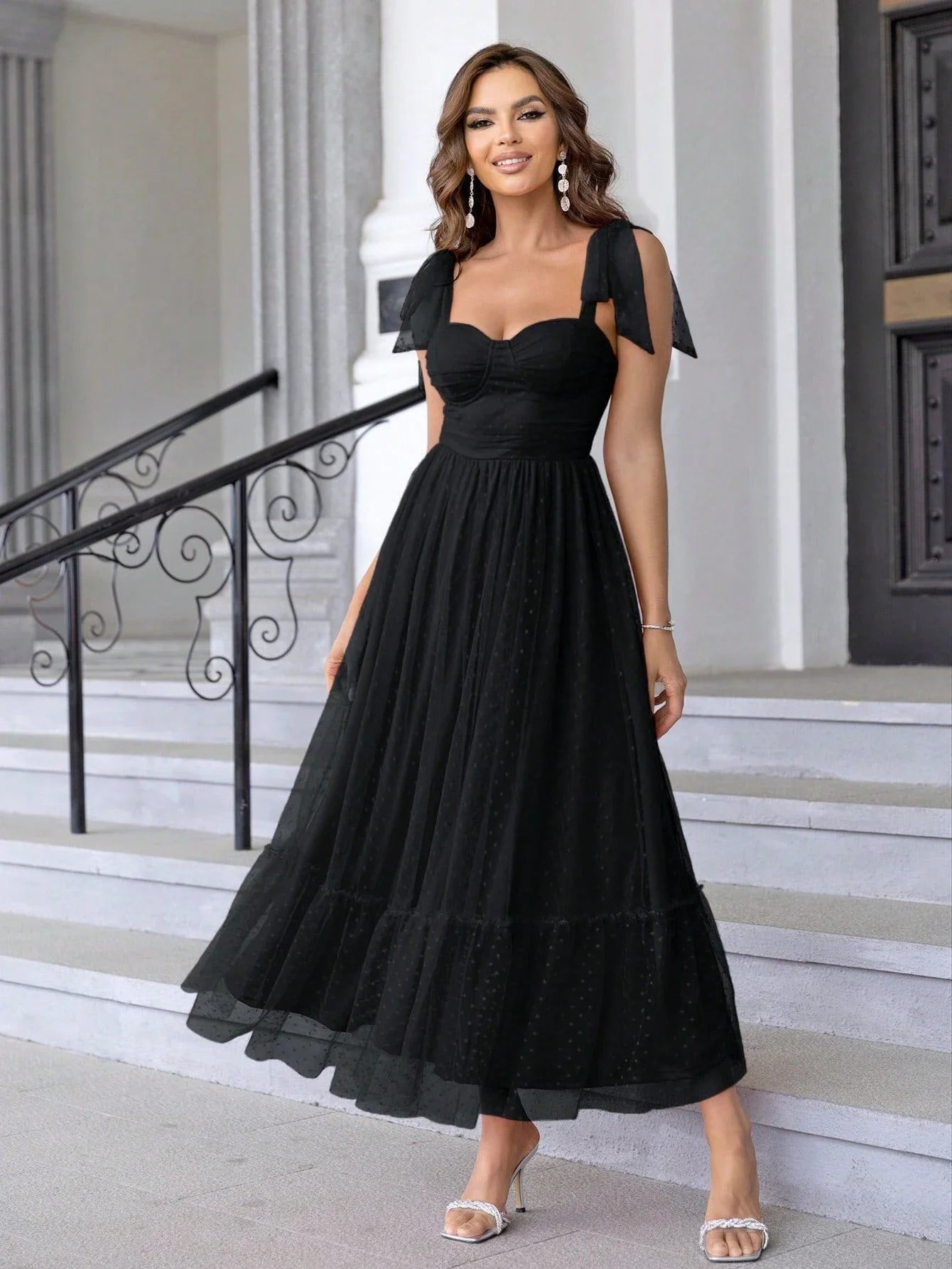 Enchanting fairy-style dress with flowing silhouette, delicate lace accents, and mid-length skirt in a classic black colour
