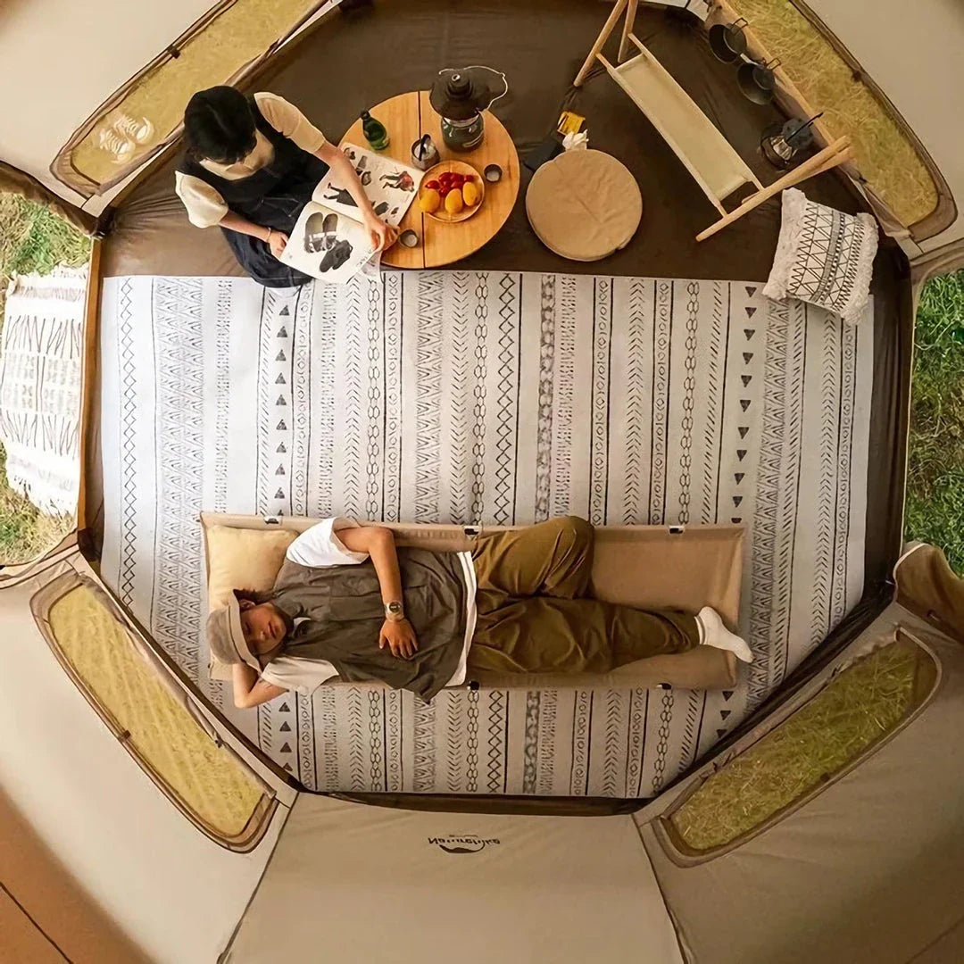 Spacious octagonal camping tent with multiple windows and a distinctive mushroom-shaped design